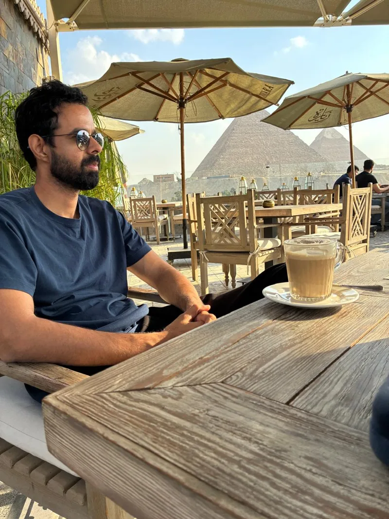Bhunesh Sharma at a cafe overlooking the pyramids