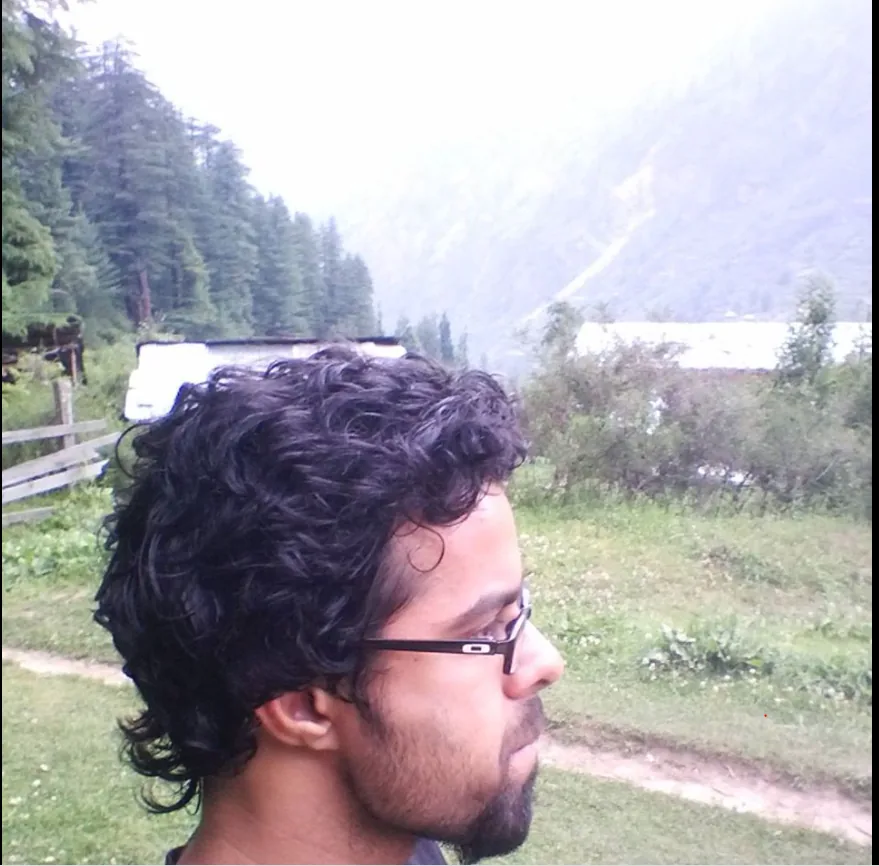 Bhunesh Sharma during a trip in a green mountain valley